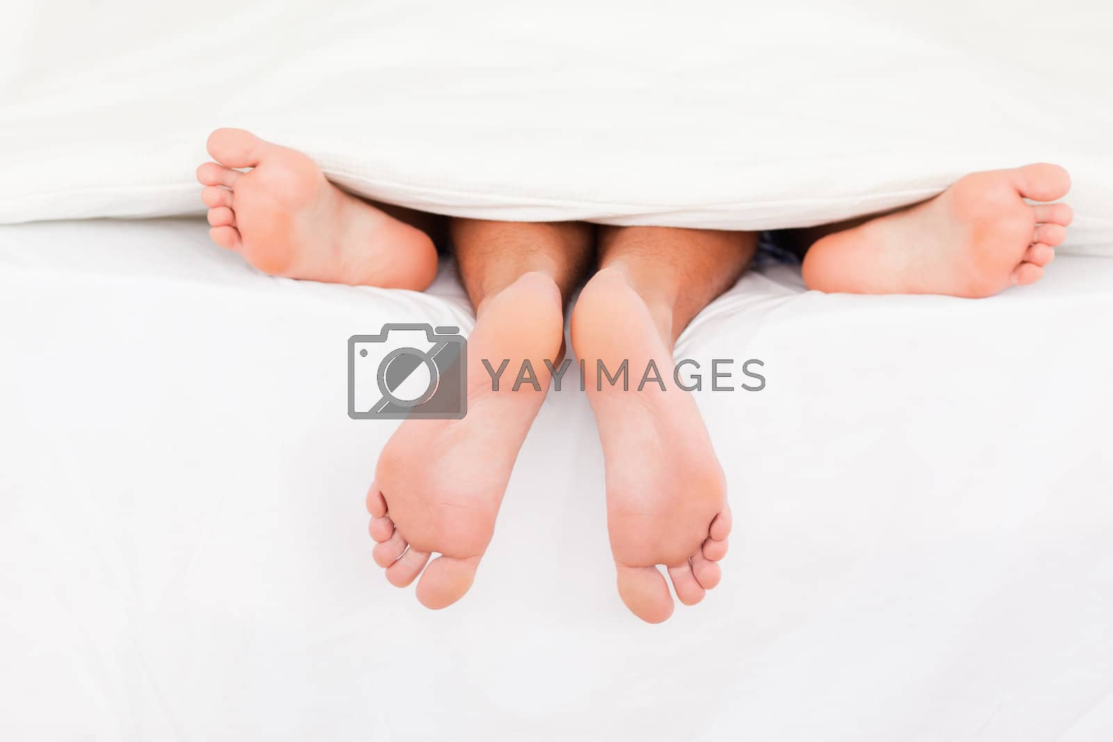 Royalty free image of A couple's feet by Wavebreakmedia