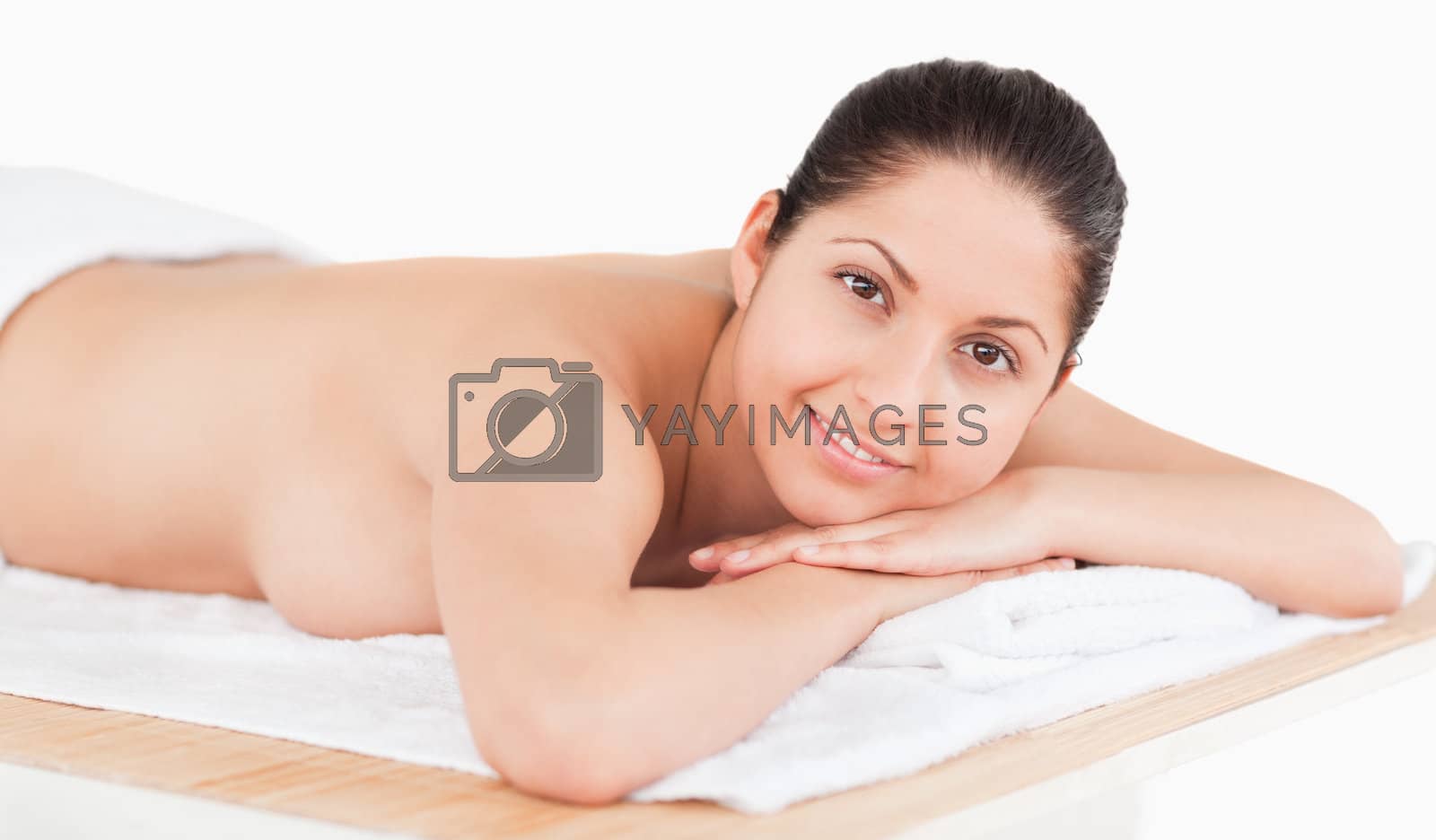 Royalty free image of brunette on a massage table by Wavebreakmedia
