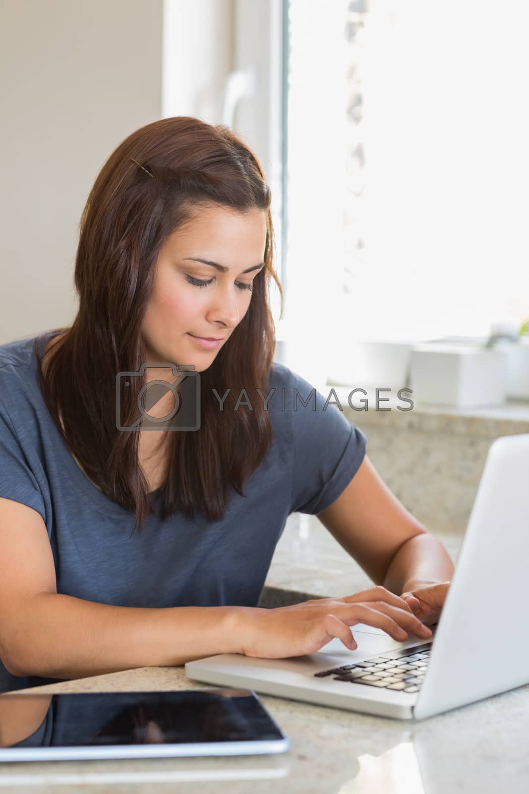 Royalty free image of Woman using laptop by Wavebreakmedia
