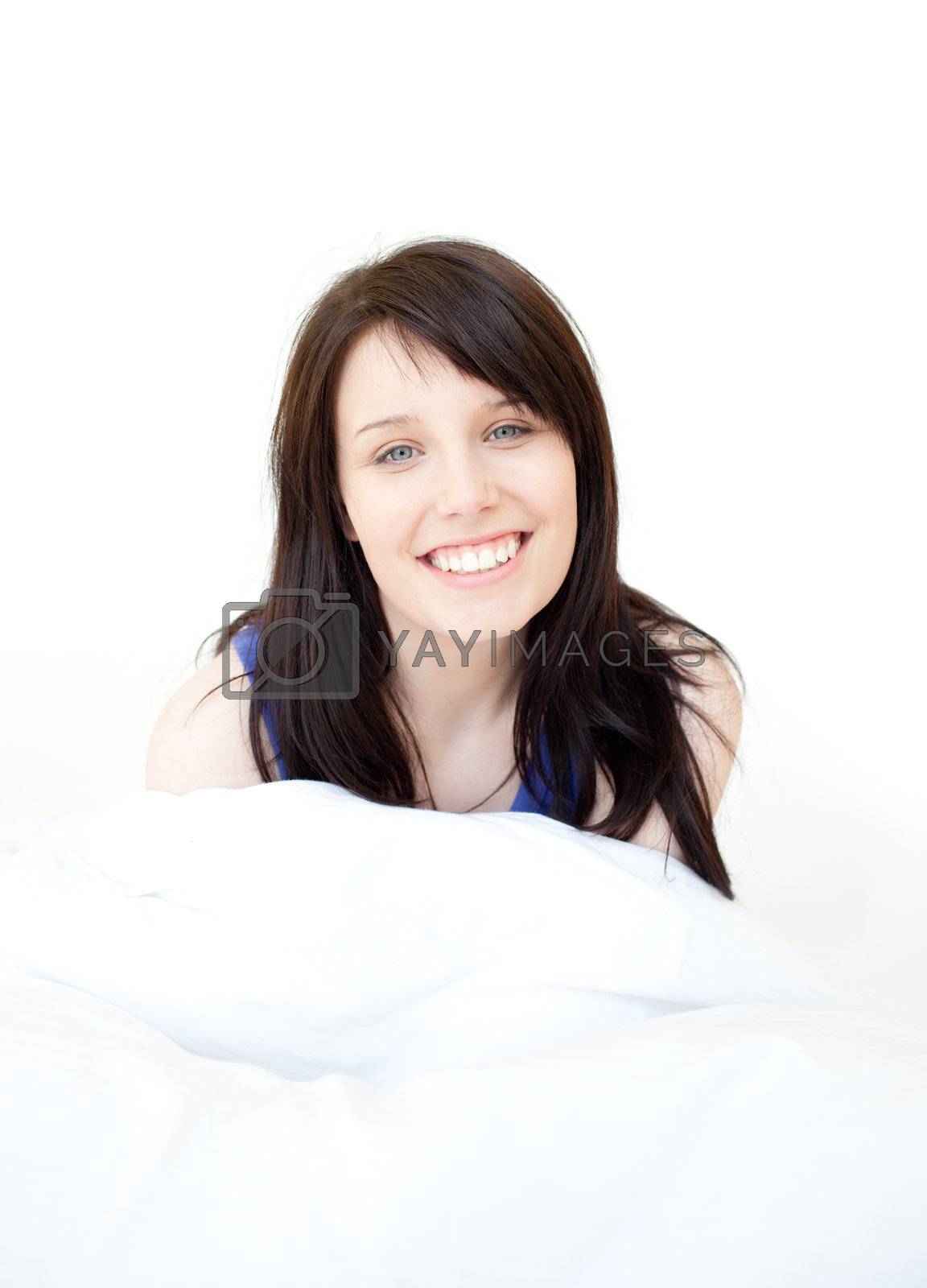 Royalty free image of Portrait of a bright woman sitting on bed by Wavebreakmedia