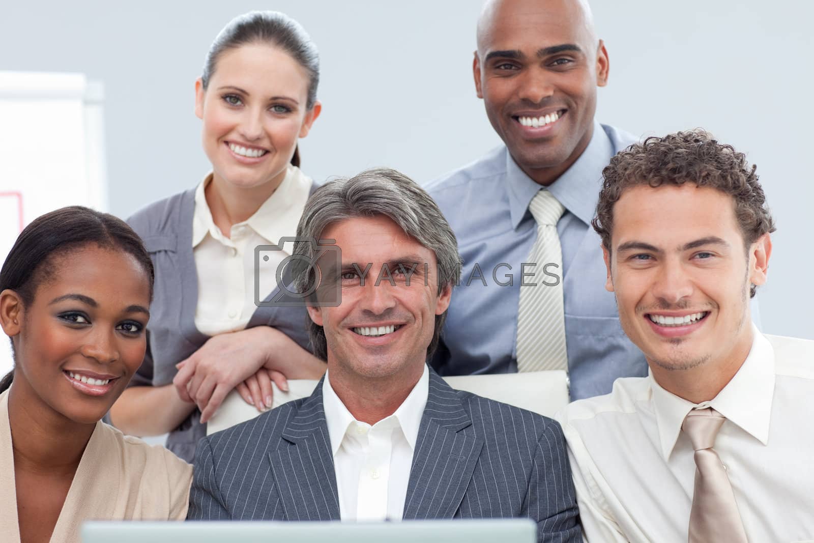 Royalty free image of Charismatic International business people using a laptop  by Wavebreakmedia