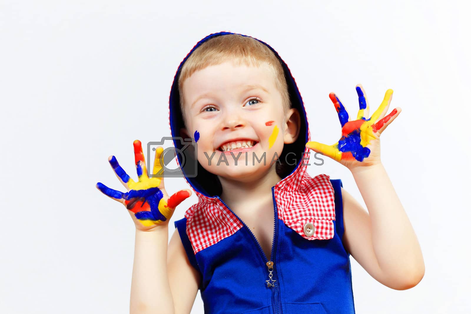 Royalty free image of happy child with paint on the hands by sergey_nivens