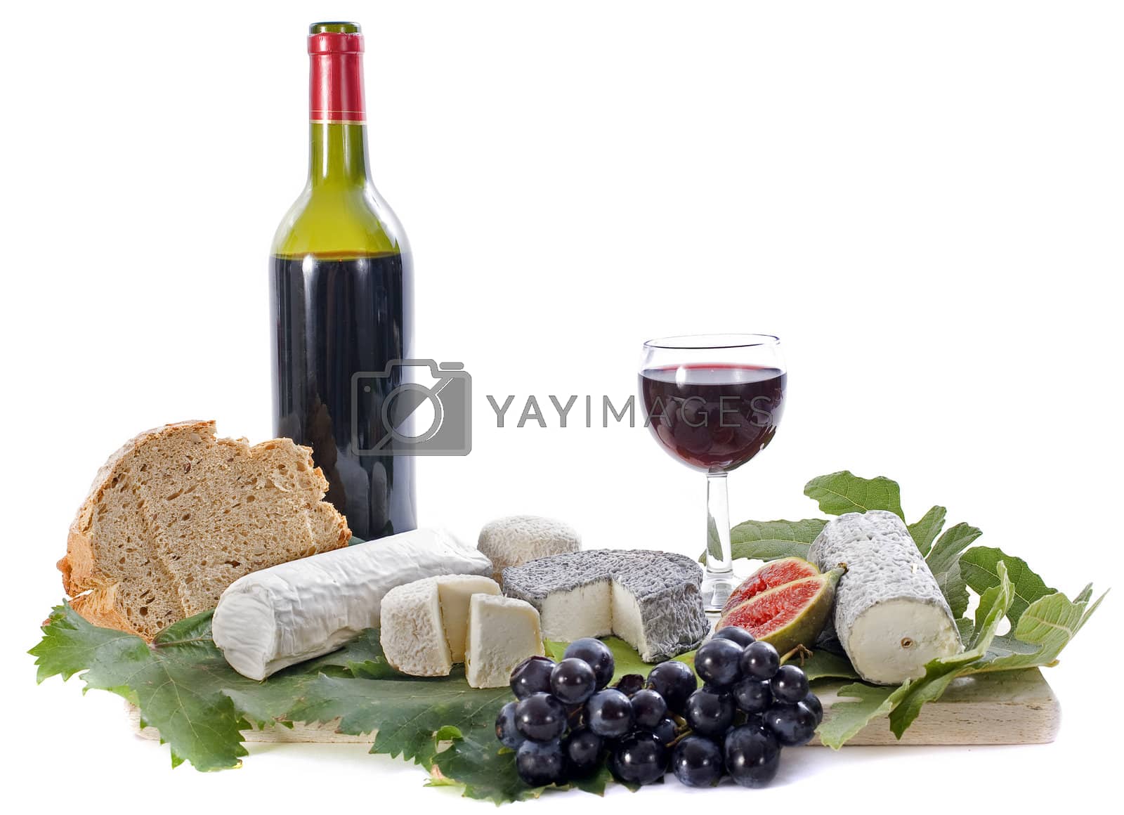 Royalty free image of goat cheeses, fruits and wine by cynoclub