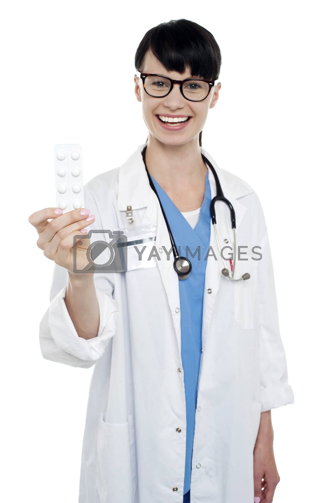 Royalty free image of Bespectacled duty doctor showing medicine strip by stockyimages