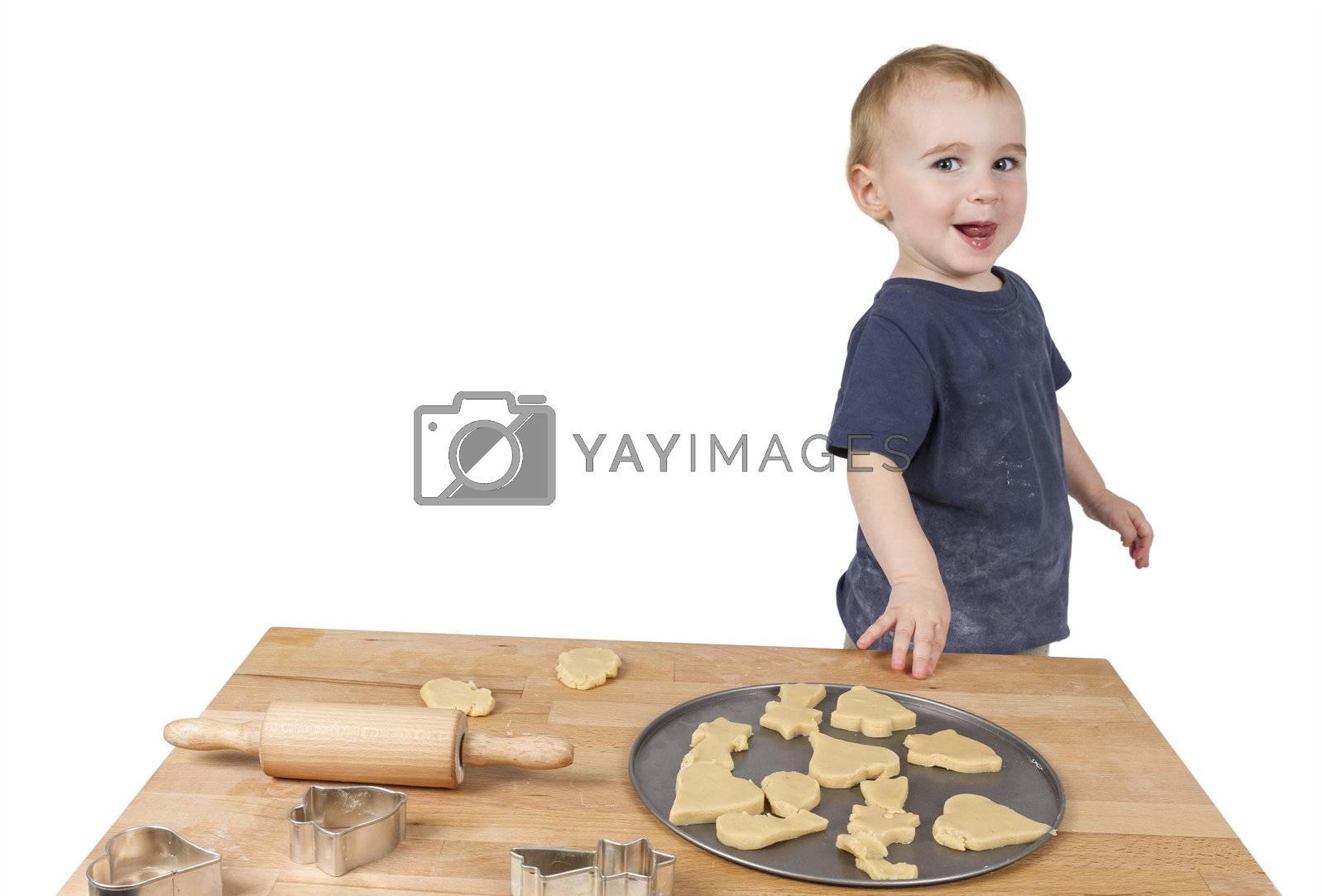 Royalty free image of child making cookies by gewoldi