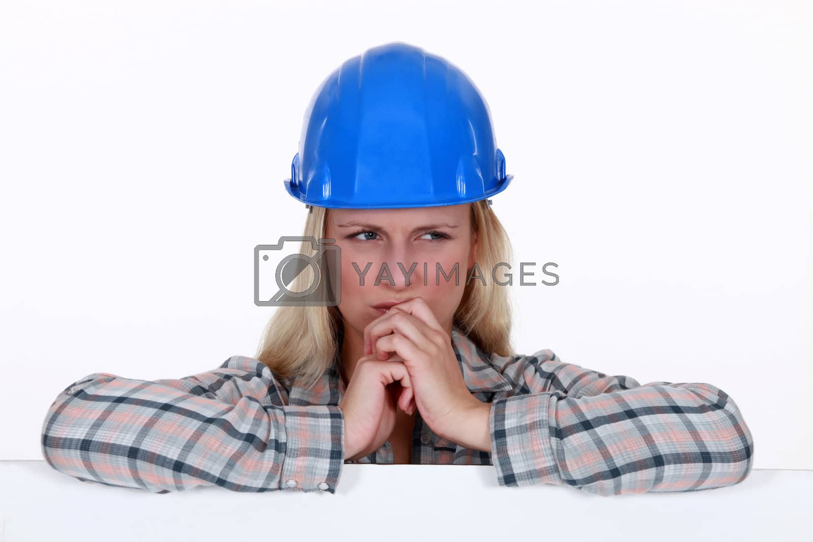 Royalty free image of Confused female laborer by phovoir