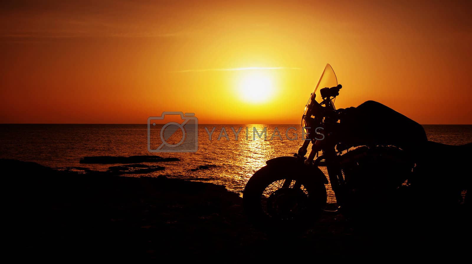 Royalty free image of Motorcycle on sunset by Anna_Omelchenko