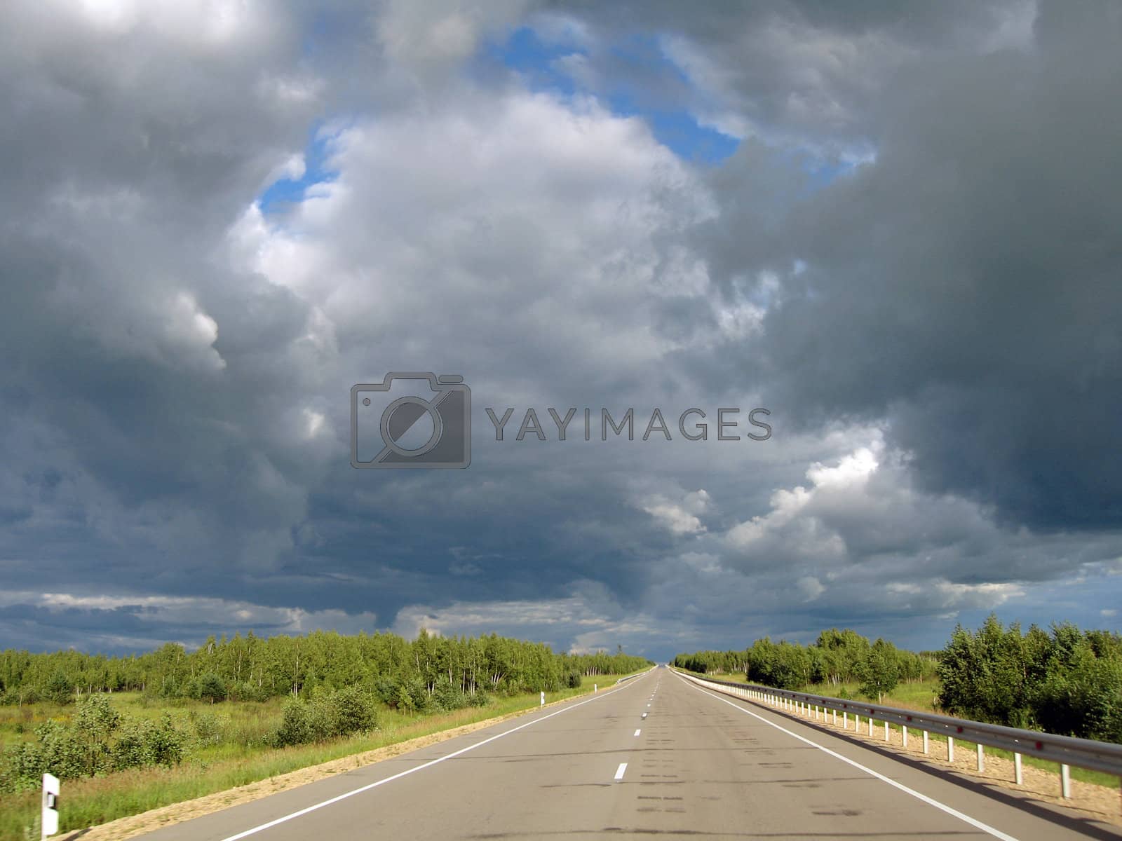 Royalty free image of Most asphalt road, against the background of clouds by aarrows