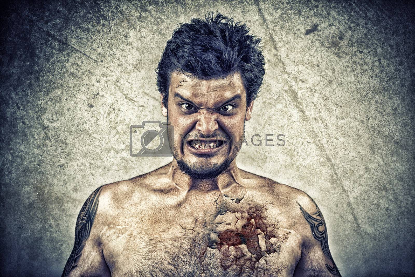 Royalty free image of Sinister face with cracked skin, and ugly face by ra2studio