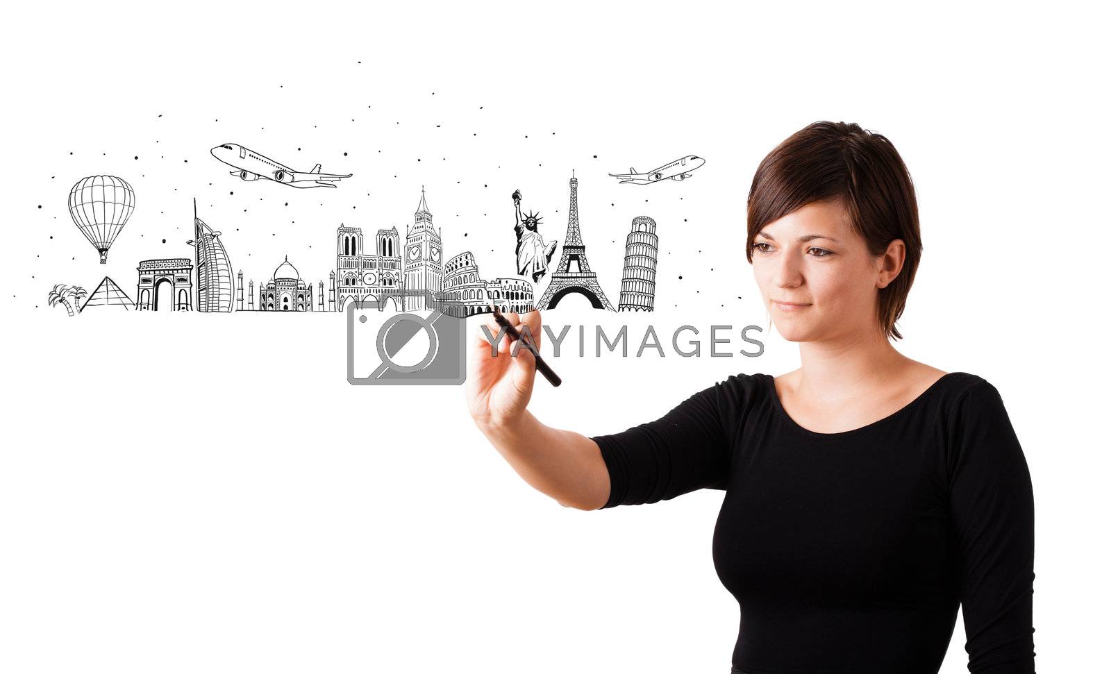 Royalty free image of Young woman drawing famous cities and landmarks on whiteboard  by ra2studio