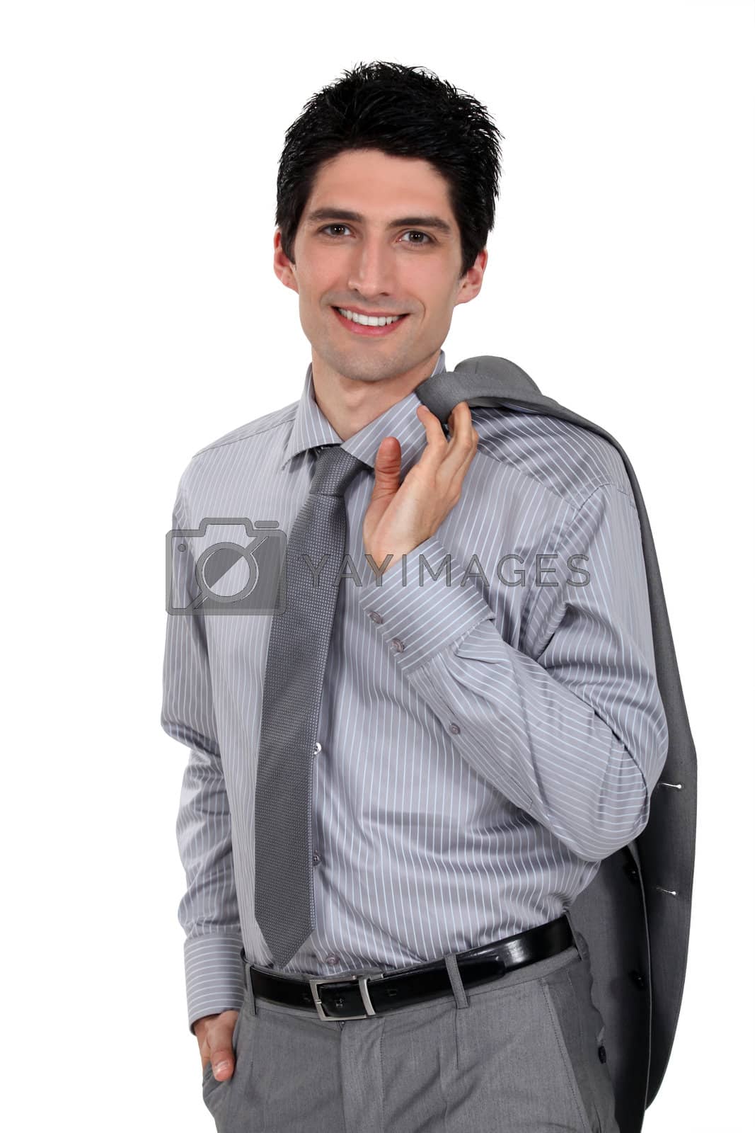 Royalty free image of Man holding his suit jacket over his shoulder by phovoir
