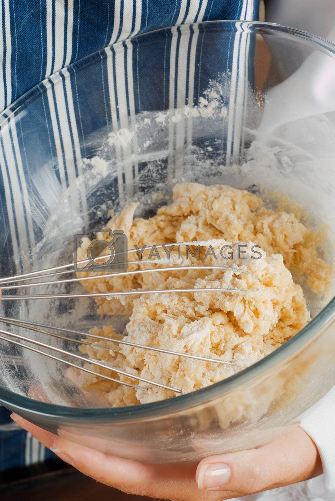 Royalty free image of Cooking making pancake mixture by alistaircotton