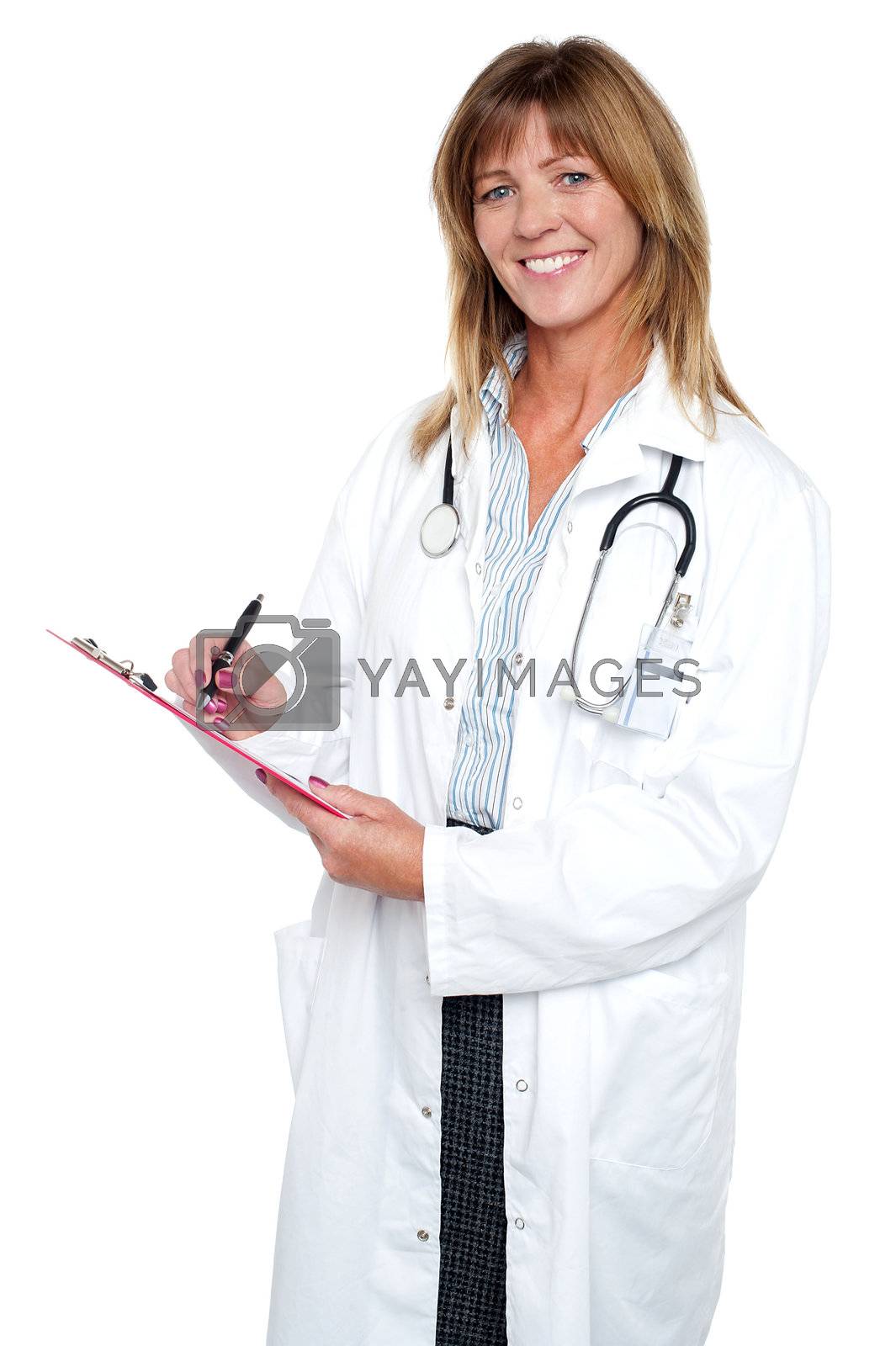 Royalty free image of Pleasing doctor collecting patient's health history by stockyimages