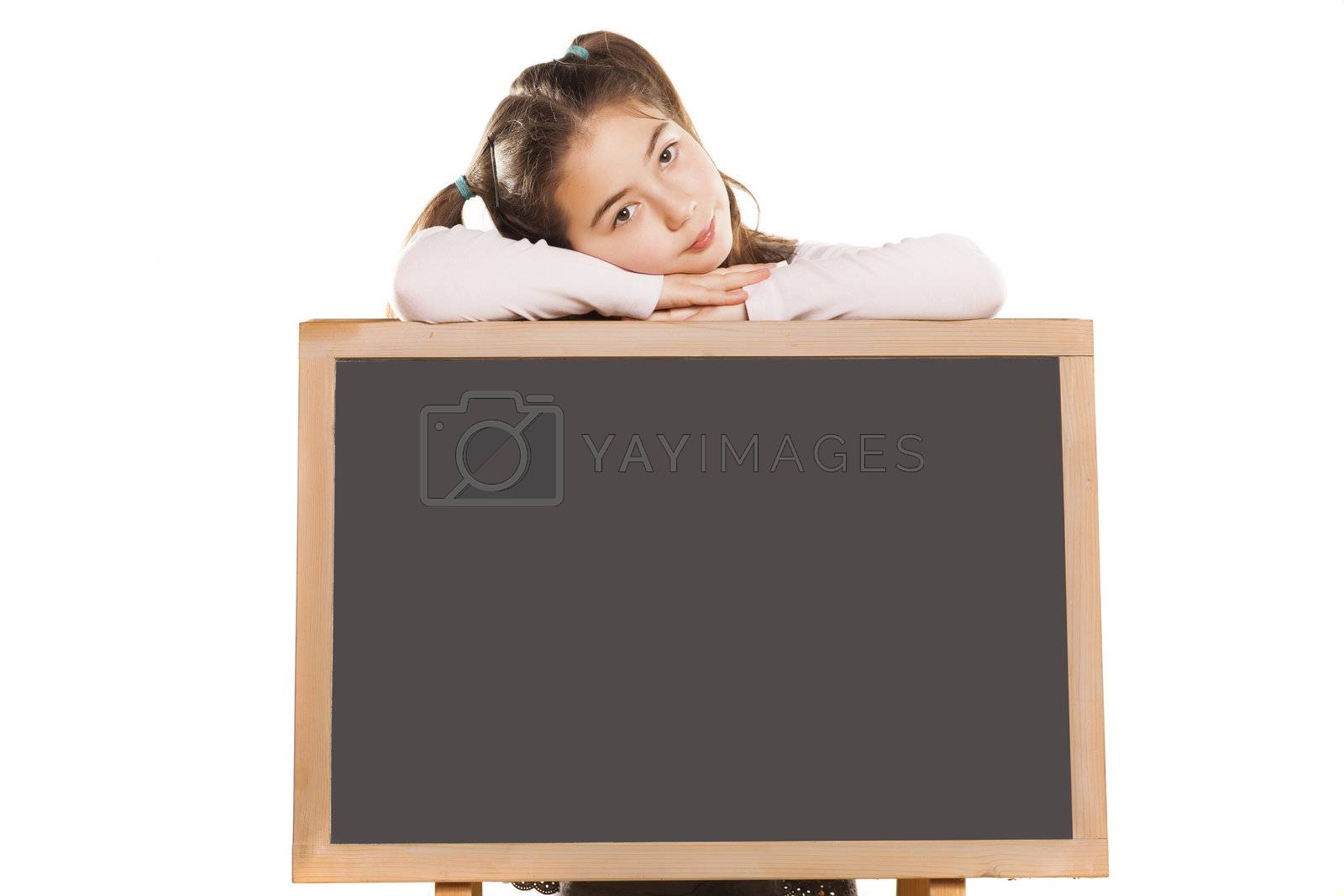 Royalty free image of little girl and empty blackboard by Vladimirfloyd