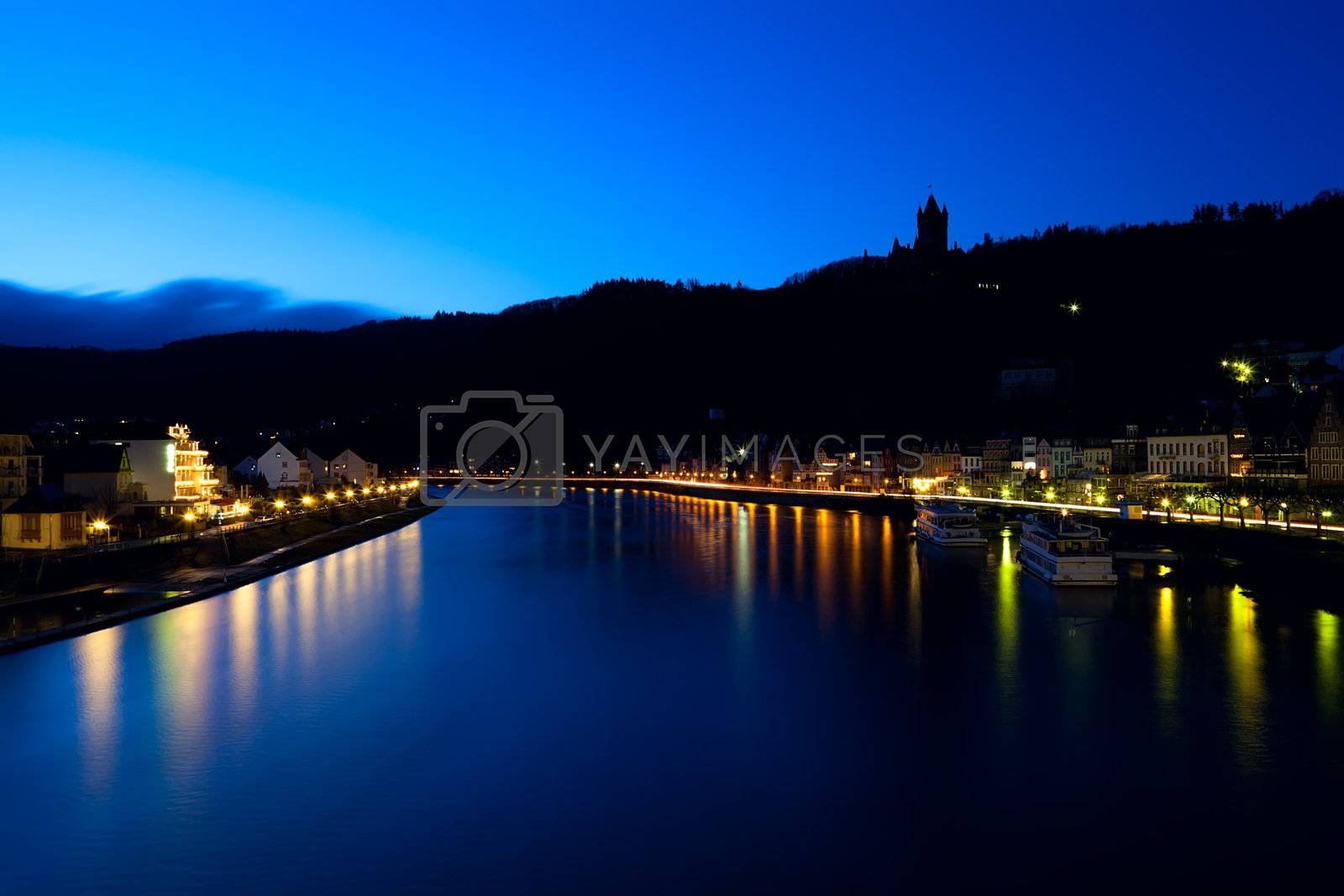 Royalty free image of silhouette of castle in Cochem at night by catolla