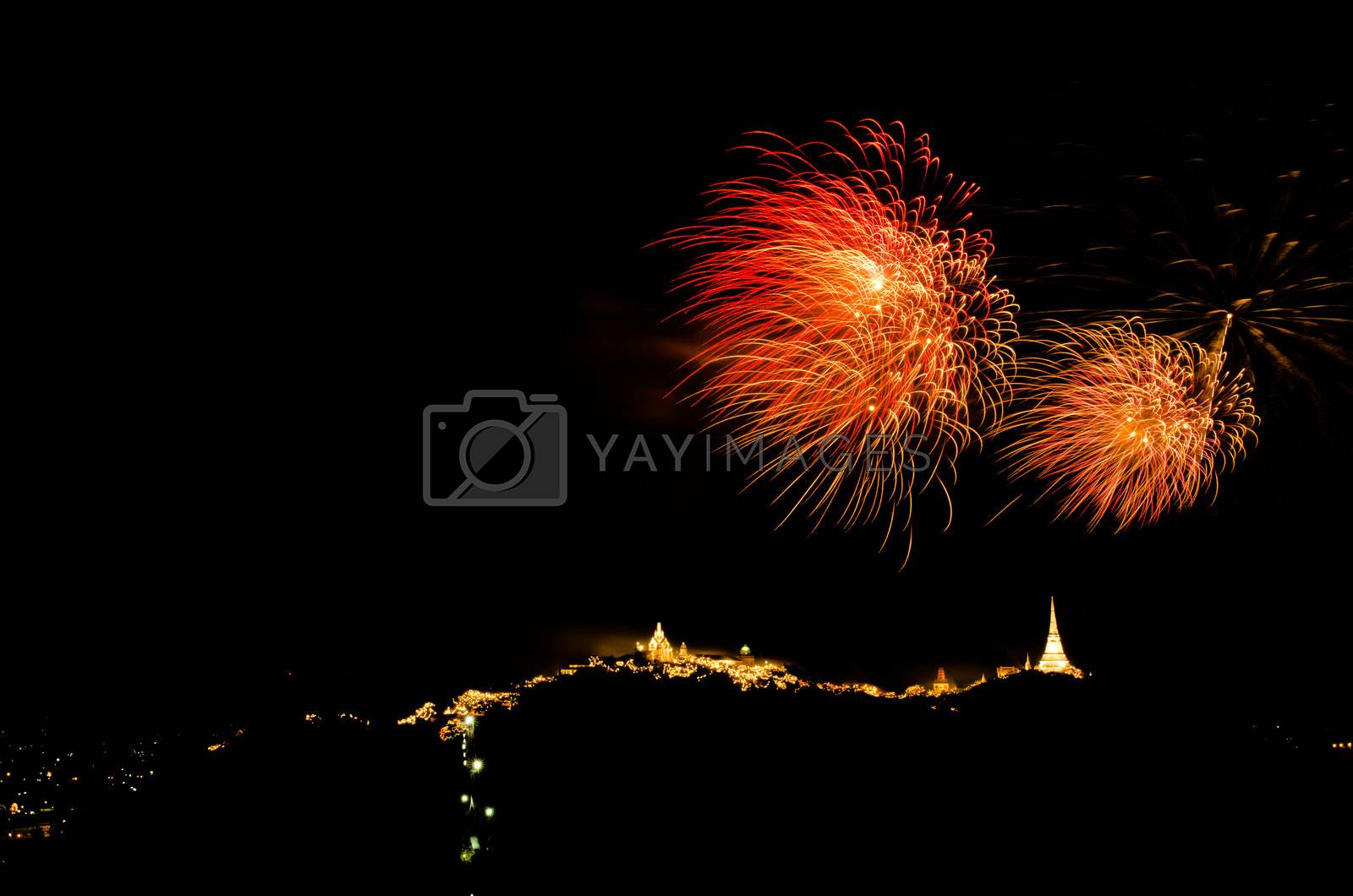 Royalty free image of fireworks display above Thai temple on the hill by hinnamsaisuy