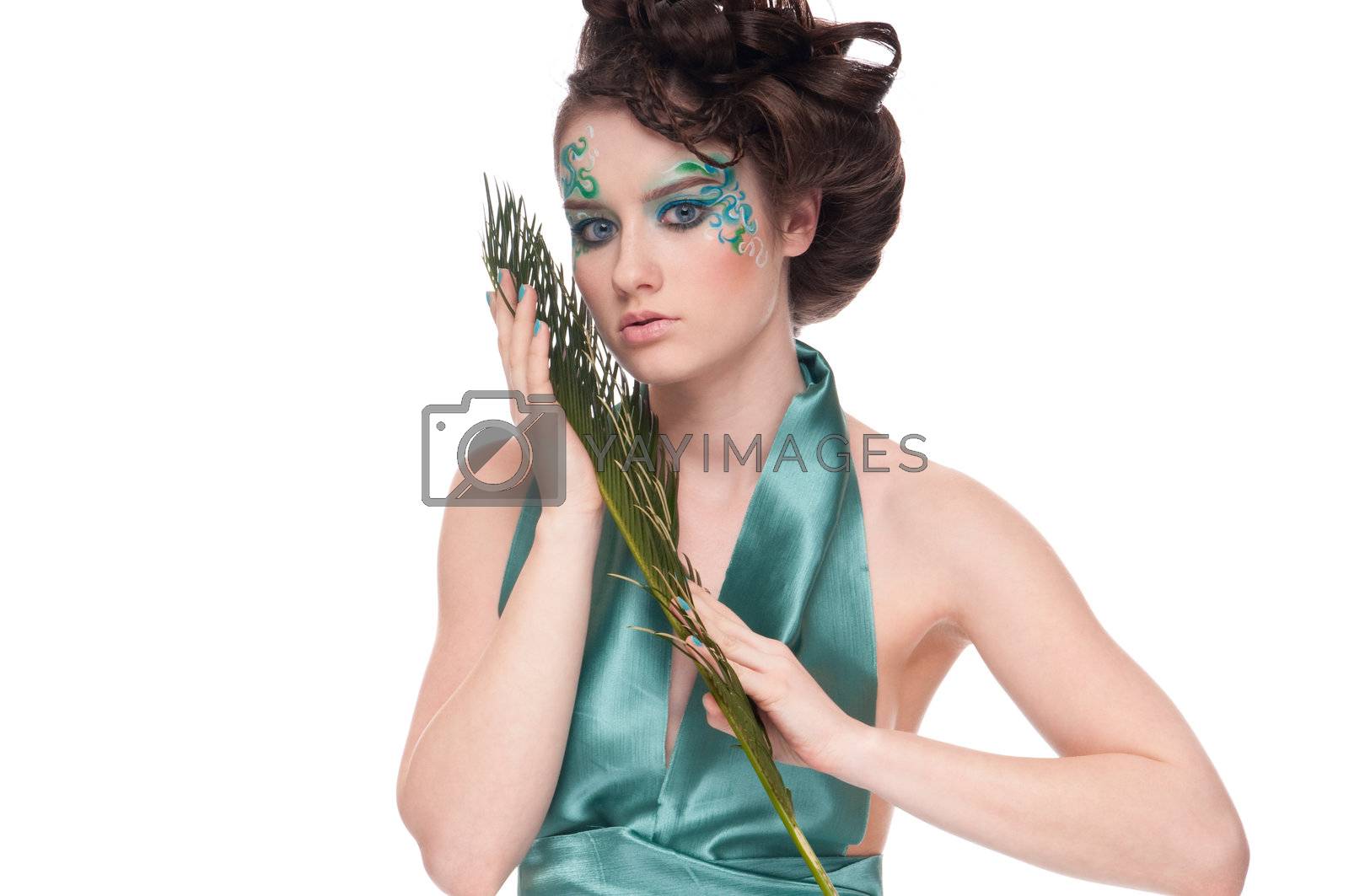 Royalty free image of Close-up of sprite girl with faceart and plant by markin