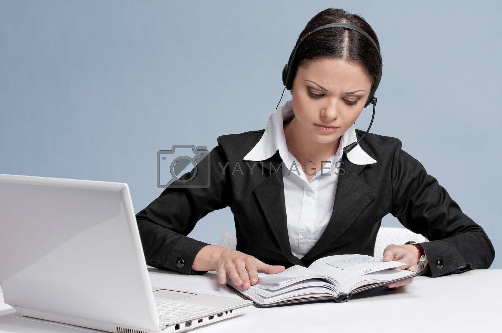Royalty free image of Business woman with headset communication by markin