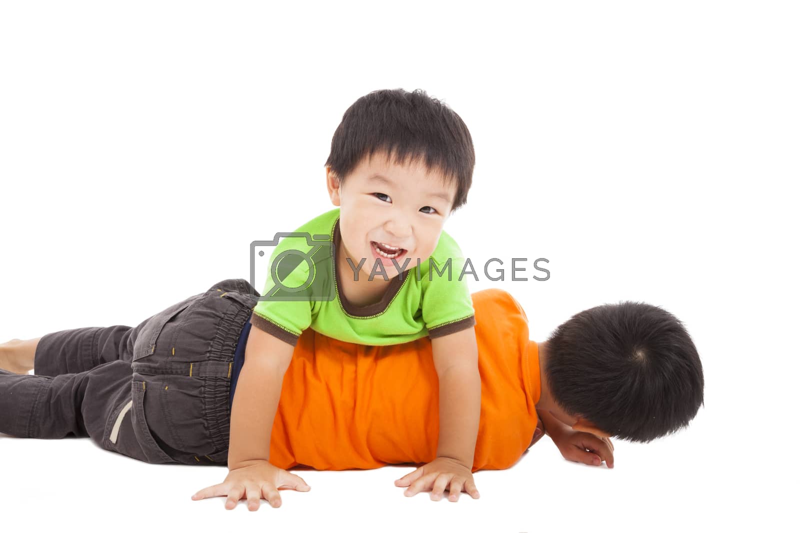 Royalty free image of happy little boy playing with his bother on the floor by tomwang