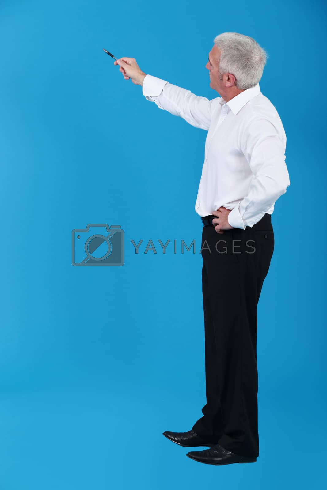 Royalty free image of Man pointing to an invisible object by phovoir