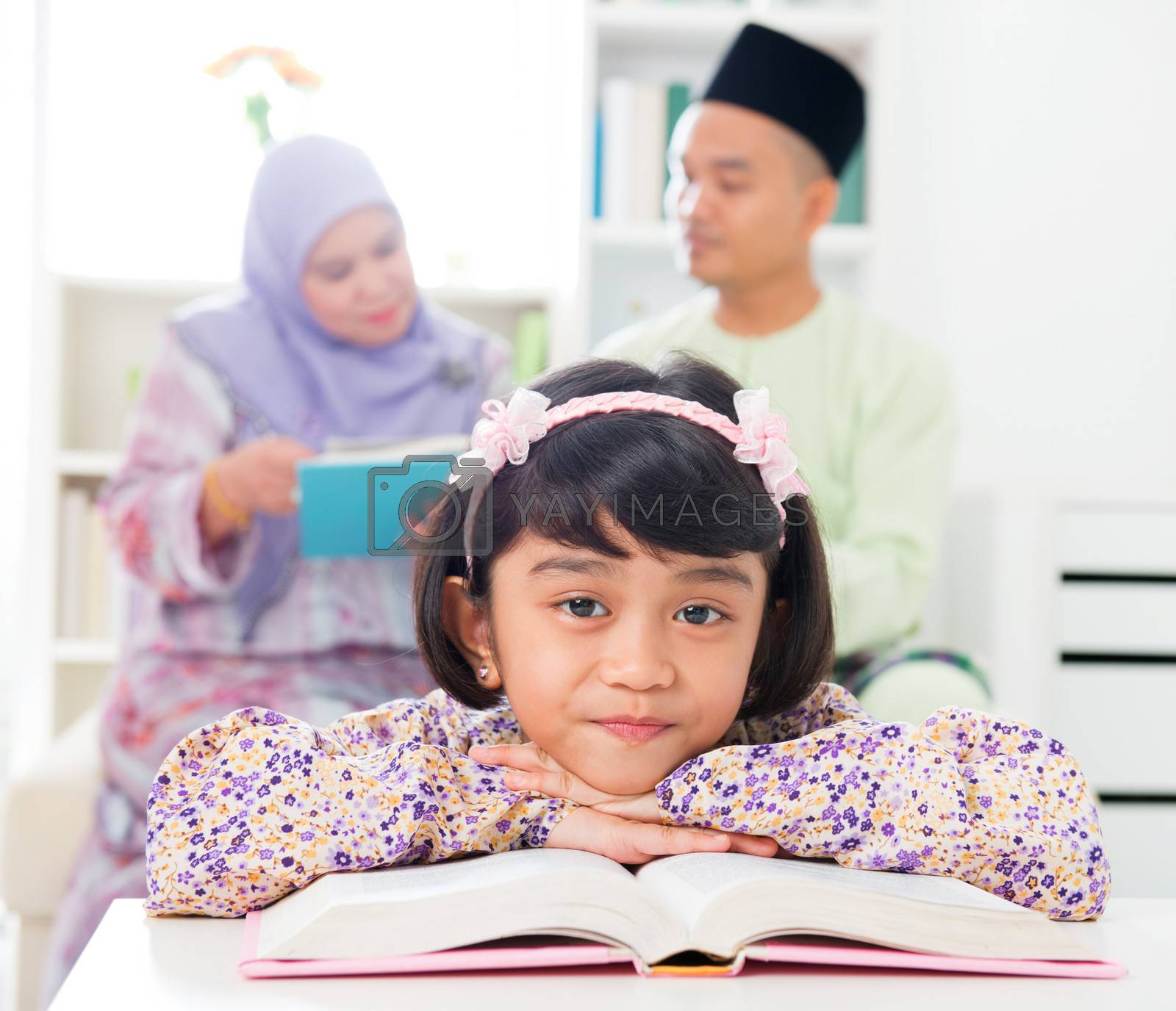 Royalty free image of Muslim girl reading book. by szefei