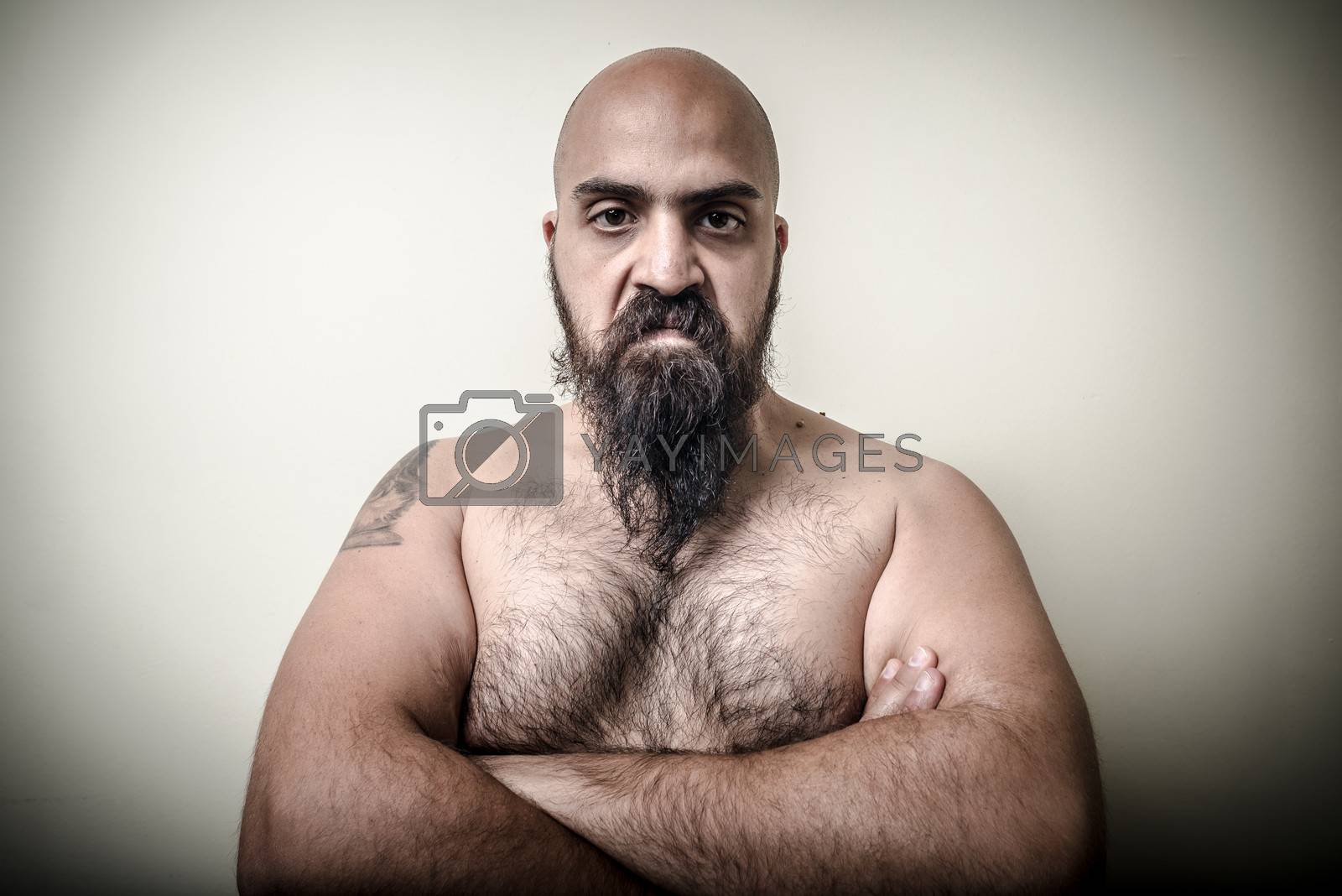 Royalty free image of super power angry muscle bearded man  by peus