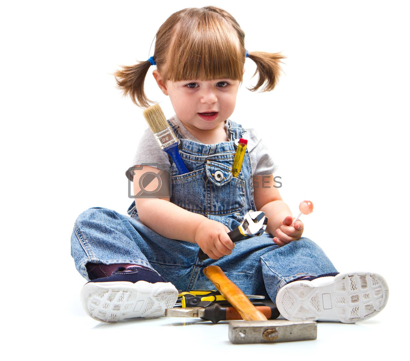 Royalty free image of baby girl with working tool by lsantilli