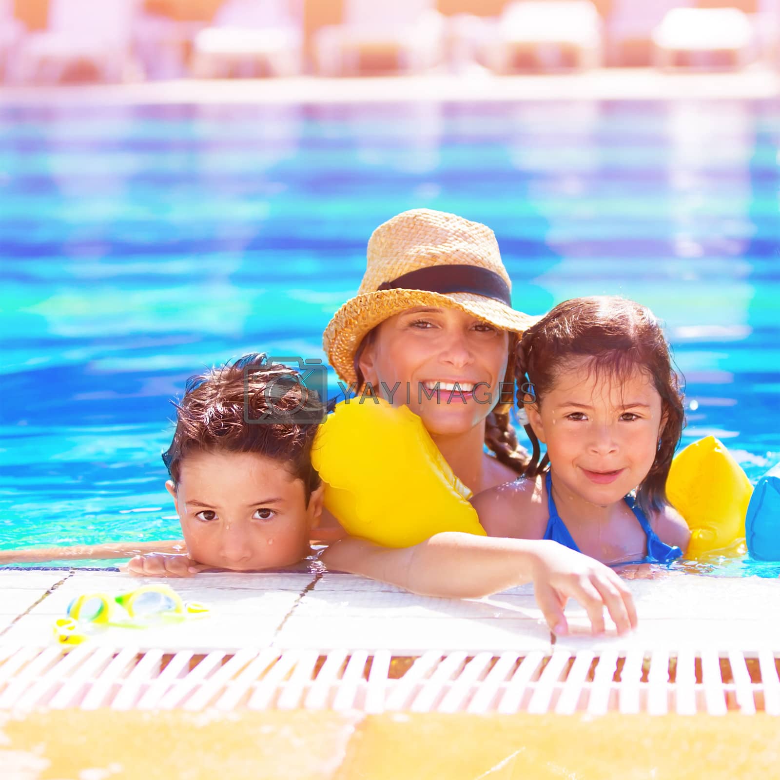 Royalty free image of Mother with kids in poolside by Anna_Omelchenko