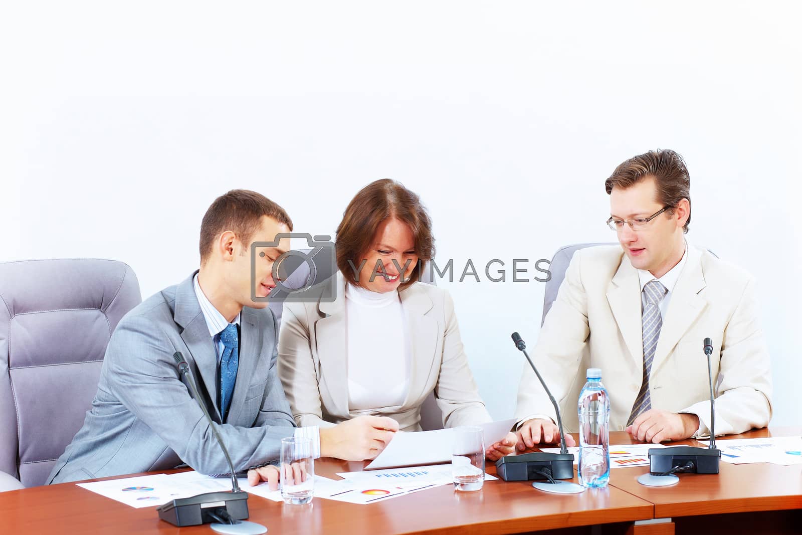 Royalty free image of Three businesspeople at meeting by sergey_nivens