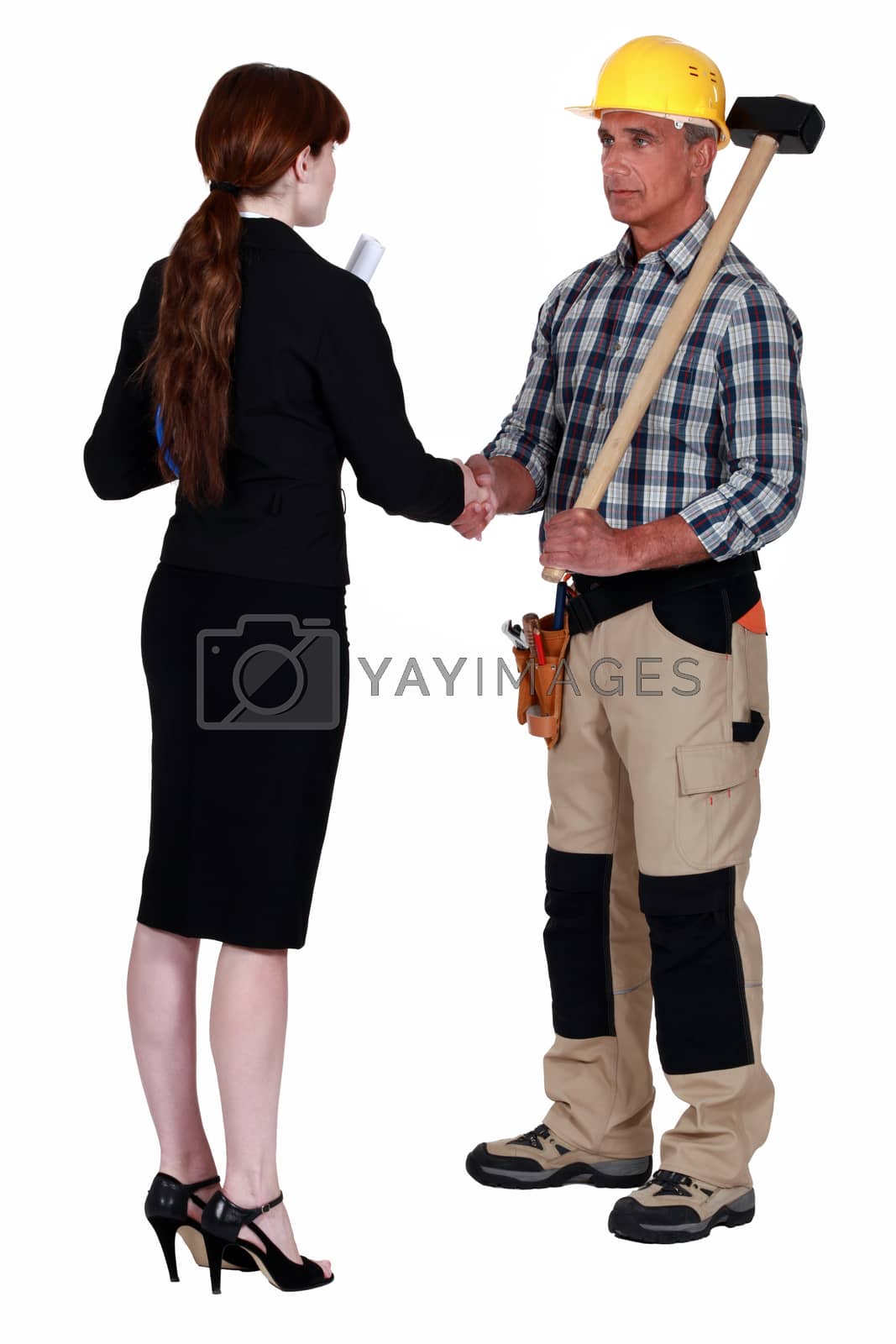 Royalty free image of Businesswoman and craftsman by phovoir