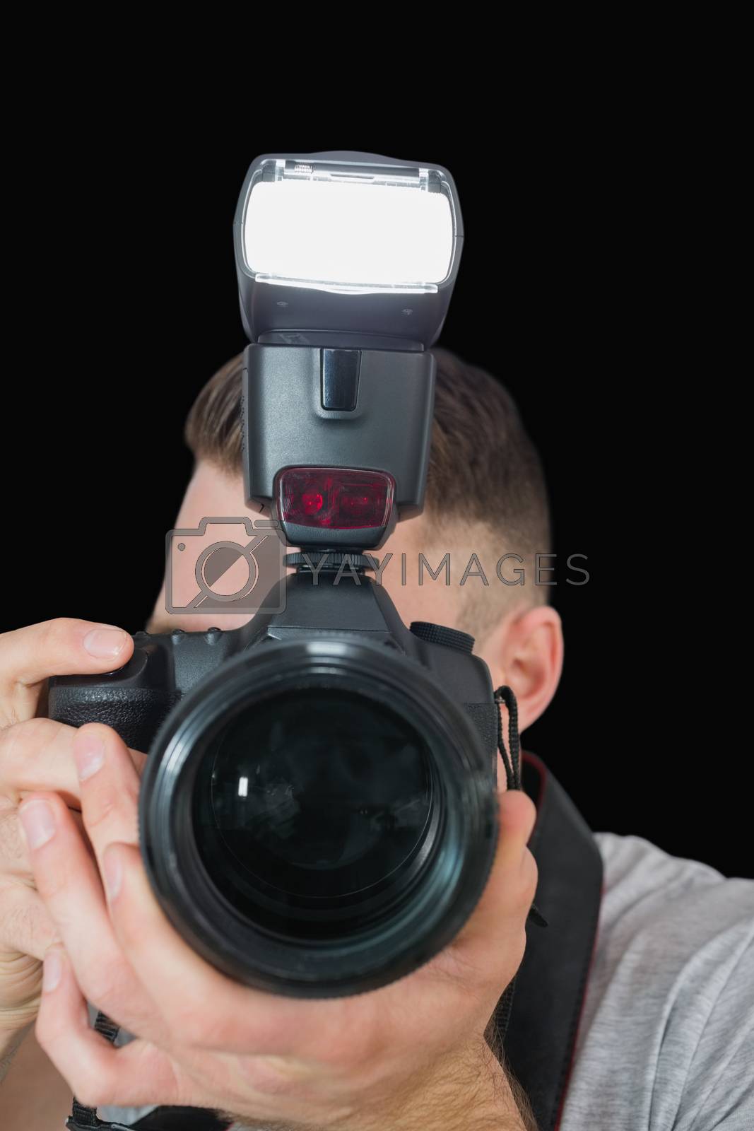 Royalty free image of Closeup of photographer with photographic camera by Wavebreakmedia