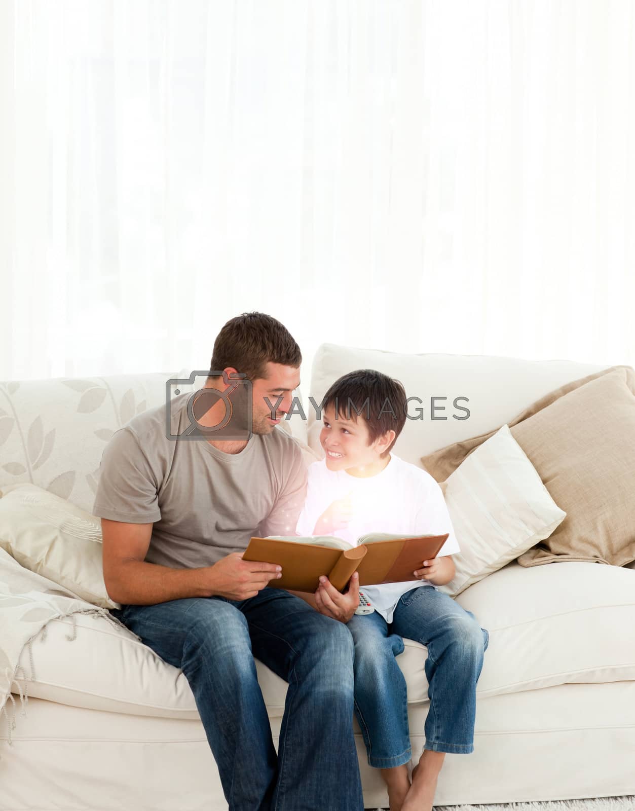 Royalty free image of Father and son reading a fairy tale by Wavebreakmedia