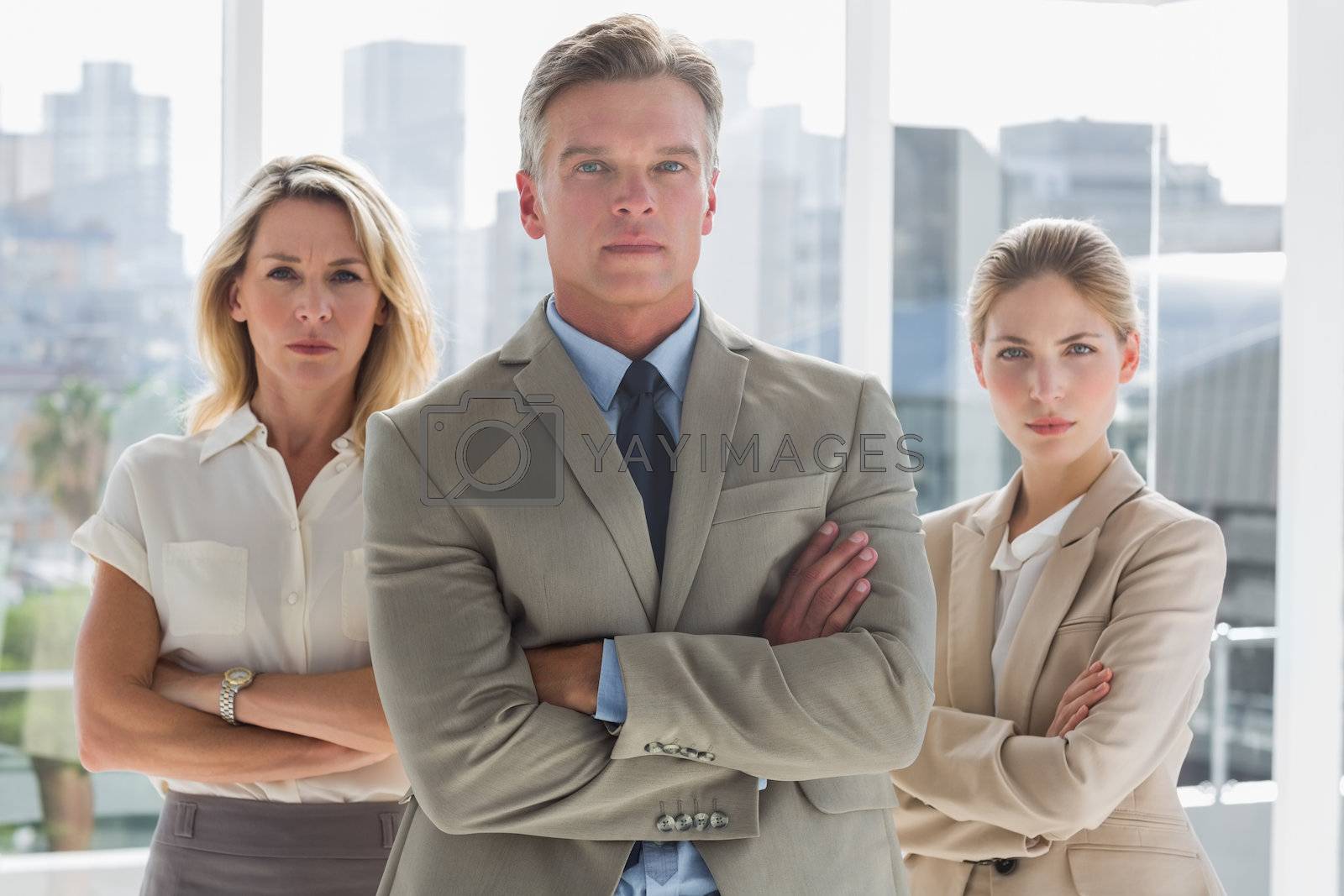 Royalty free image of Three business people standing together by Wavebreakmedia