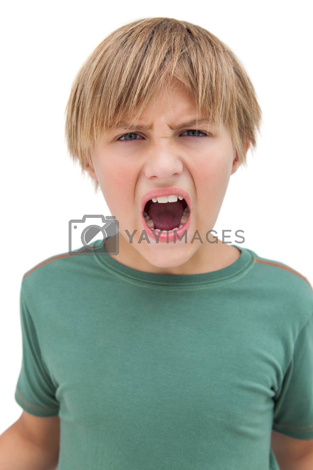Royalty free image of Furious little boy shouting  by Wavebreakmedia