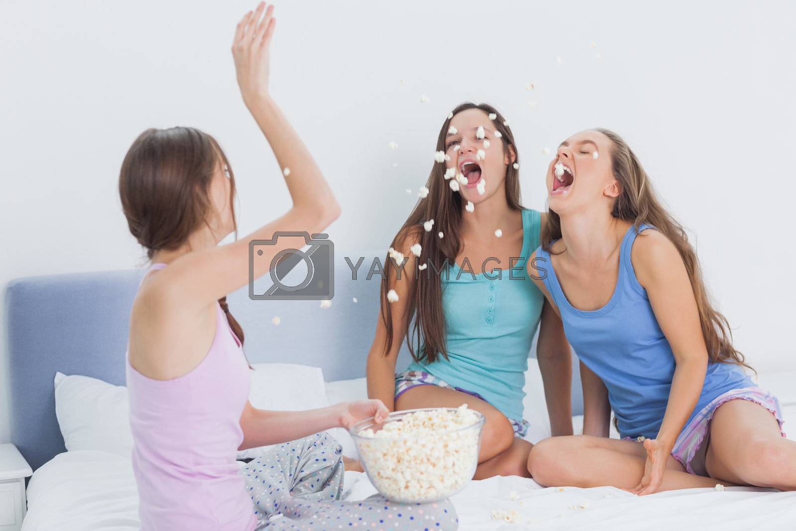 Royalty free image of Friends messing around at slumber party by Wavebreakmedia