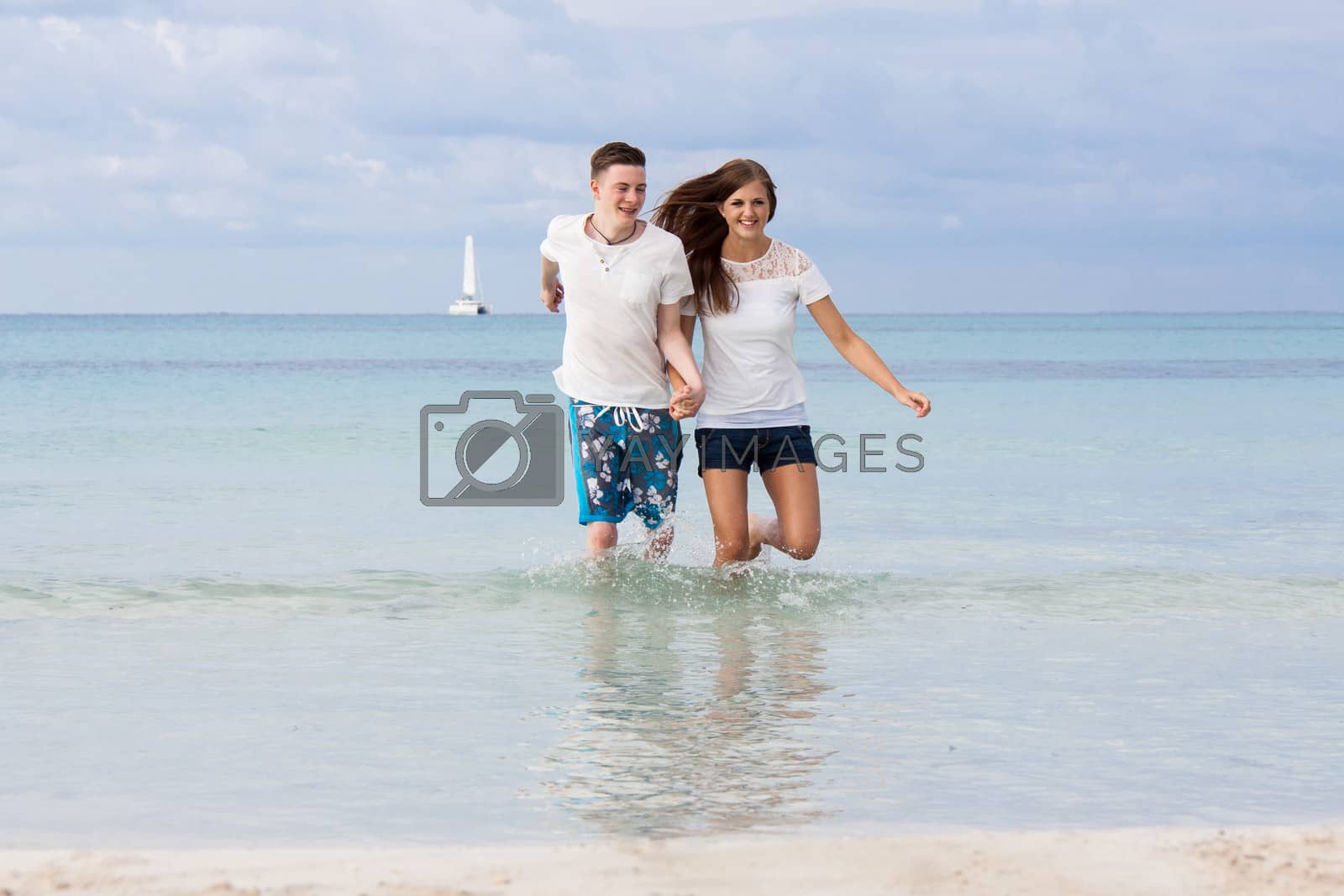 Royalty free image of young happy couple in summer holiday vacation summertime by juniart