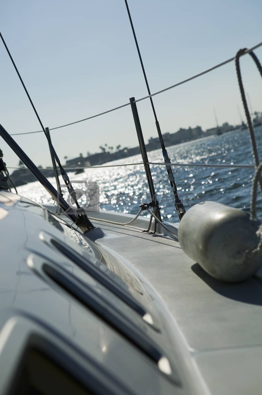 Royalty free image of Closeup of cropped starboard on sailboat against clear sky by moodboard