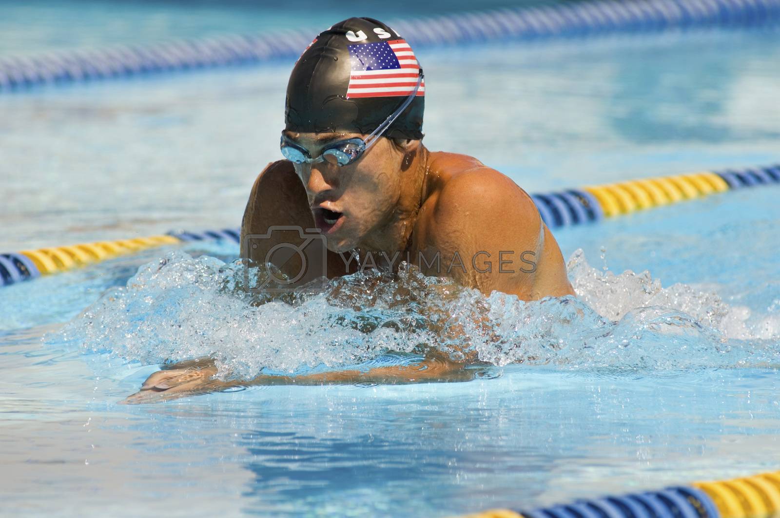 Royalty free image of American male participant competing in a swimming race by moodboard