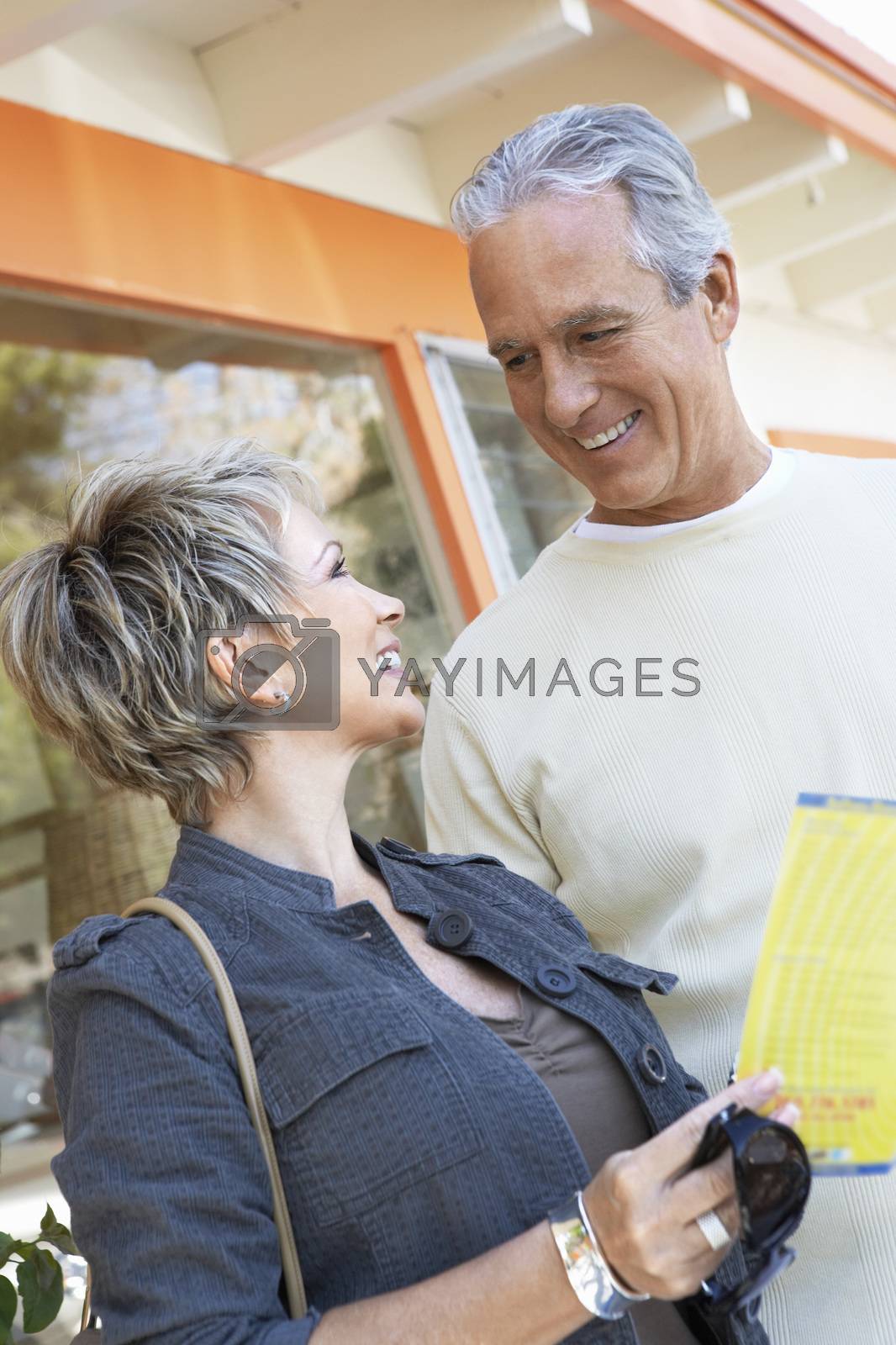 Royalty free image of Happy mature couple on vacation looking at each other by moodboard