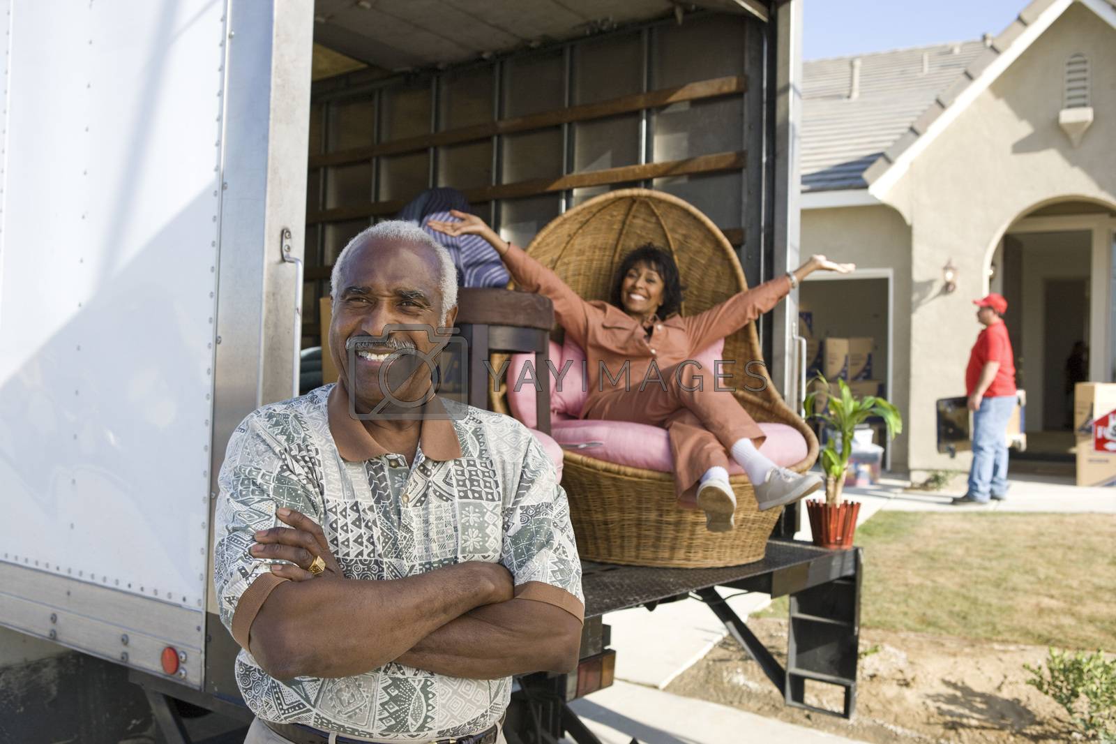 Royalty free image of Portrait of happy African American couple moving into a new house by moodboard