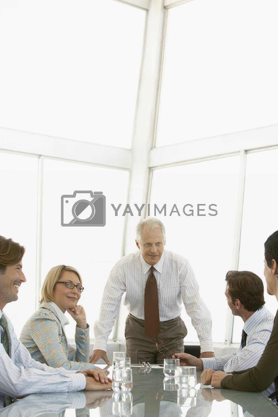 Royalty free image of Businesspeople in conference meeting by moodboard