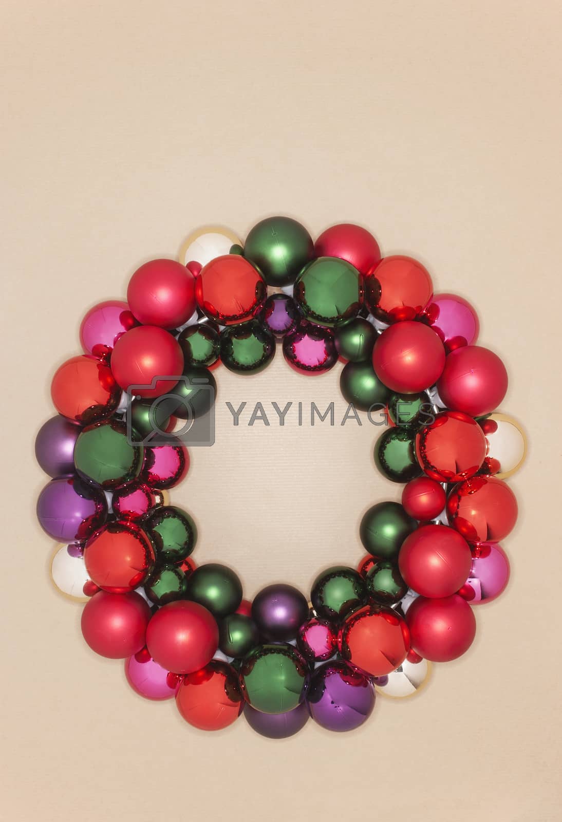 Royalty free image of Closeup of Christmas wreath over colored background by moodboard