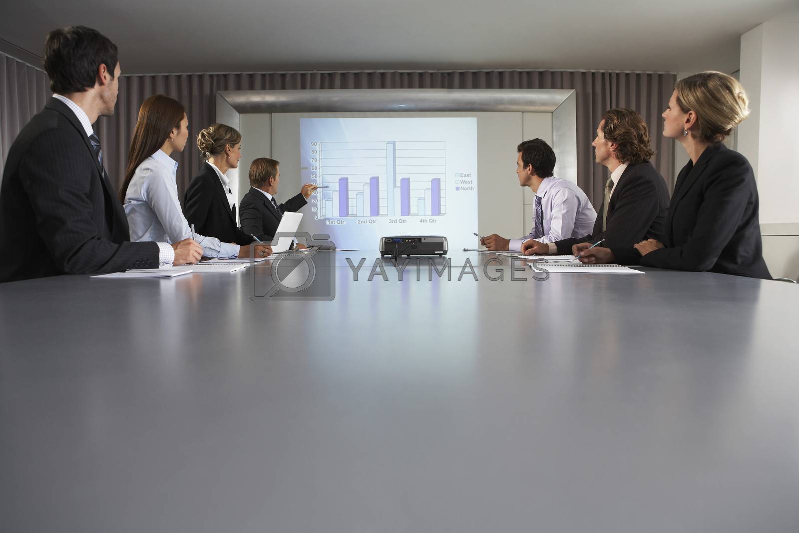Royalty free image of Businessman Giving Presentation in Conference Room by moodboard