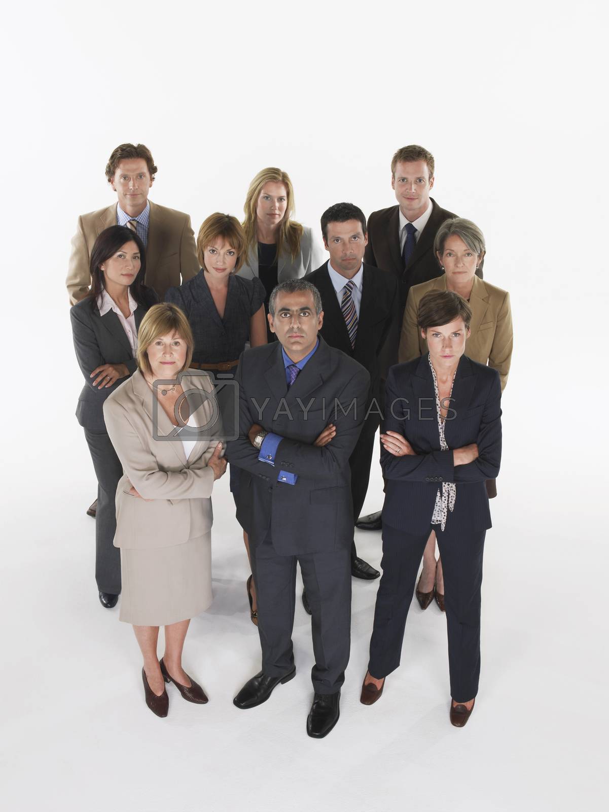 Royalty free image of Group of businesspeople in triangle formation by moodboard