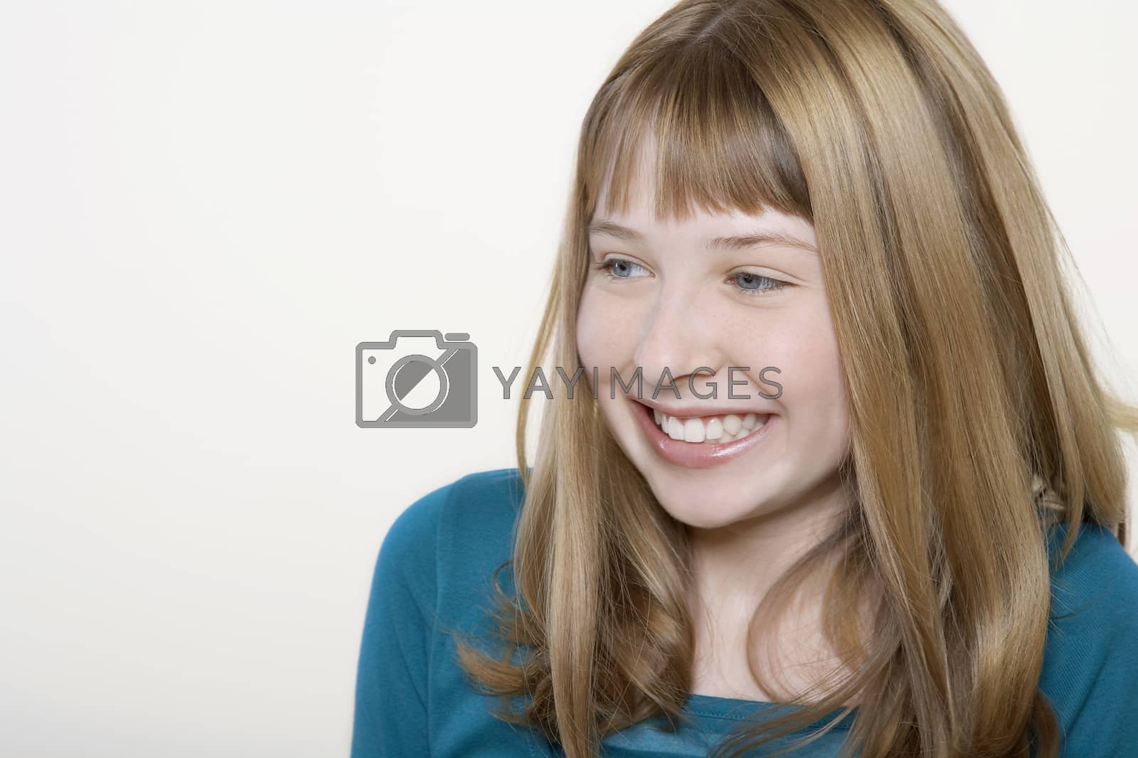 Royalty free image of Smiling teenage girl close-up by moodboard