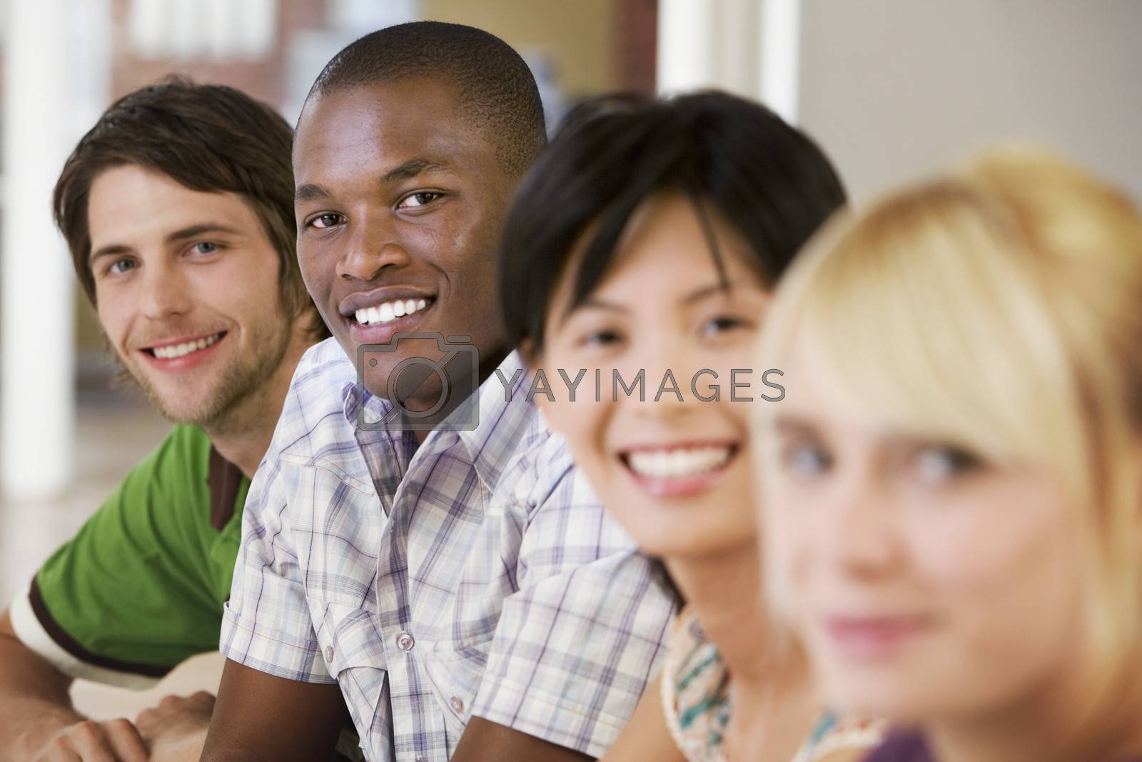 Royalty free image of Happy businessmen with female colleagues in meeting room by moodboard