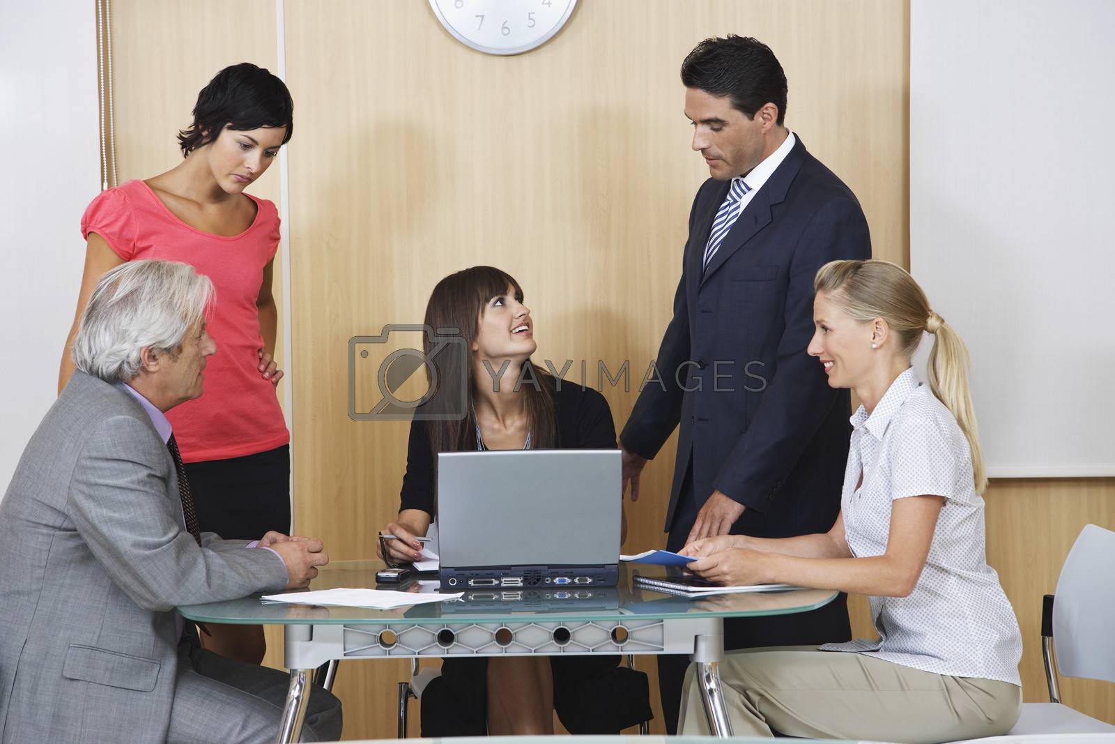 Royalty free image of Business people having meeting in conference room by moodboard