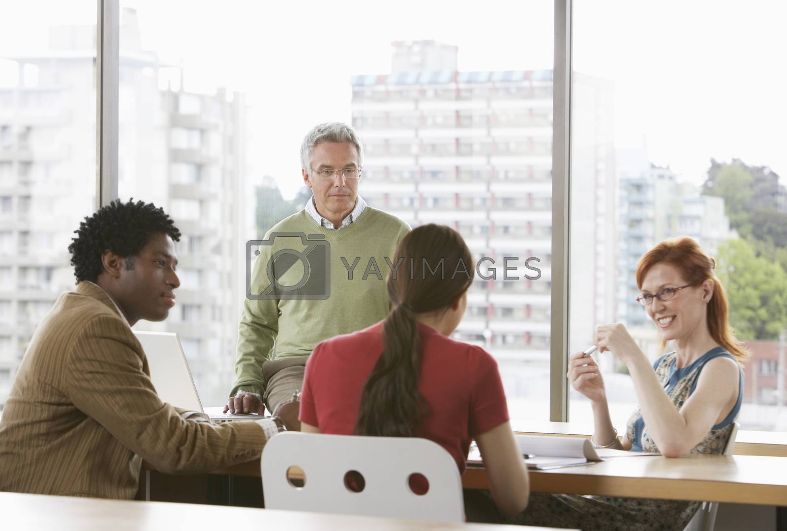 Royalty free image of Group of business colleagues at office meeting by moodboard