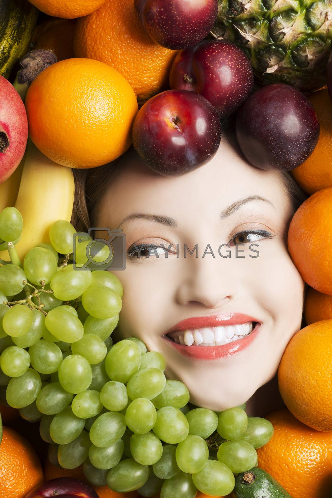 Royalty free image of Woman face in fruits. by BDS