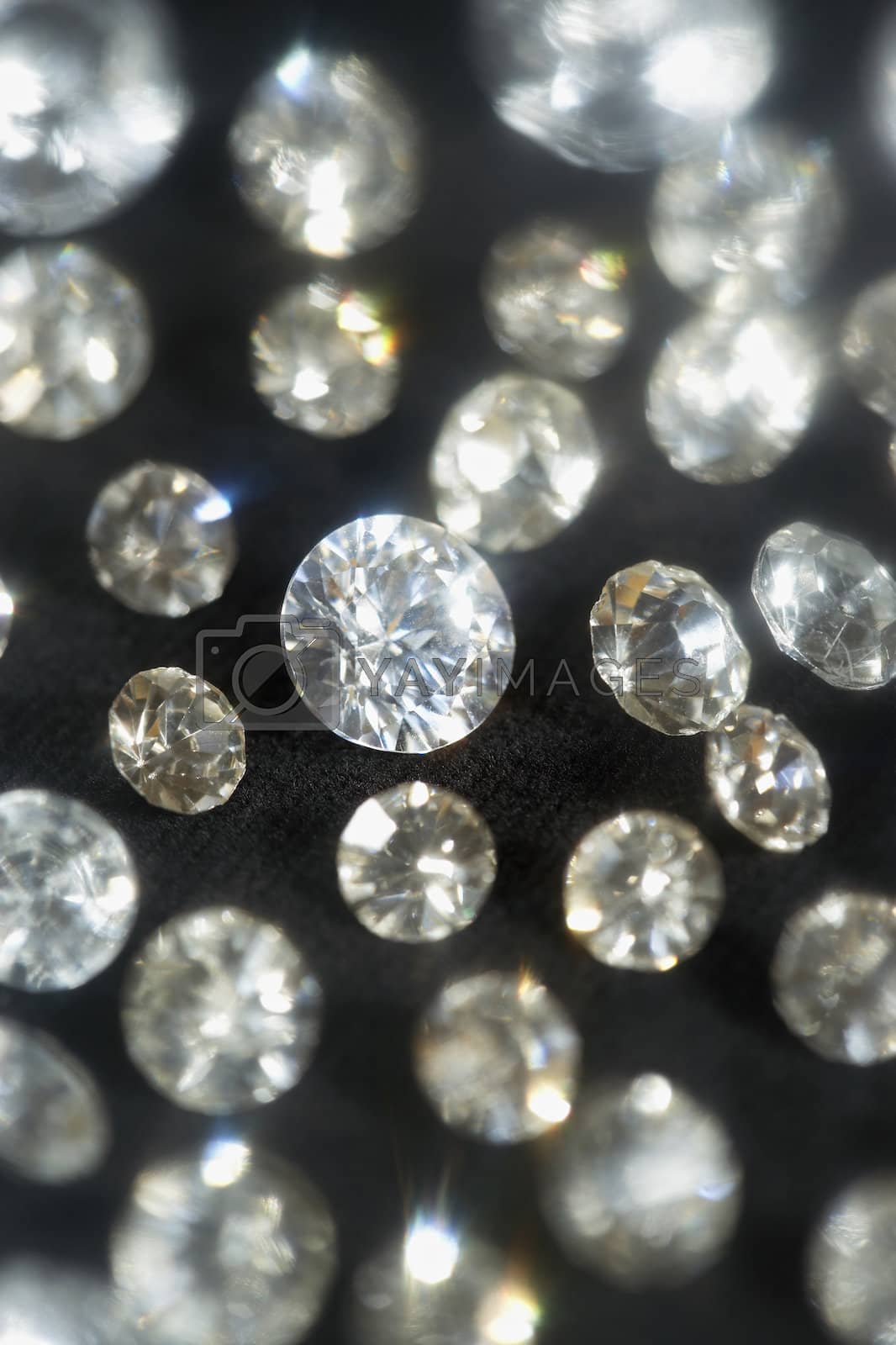 Royalty free image of Diamonds on black background selective focus by moodboard